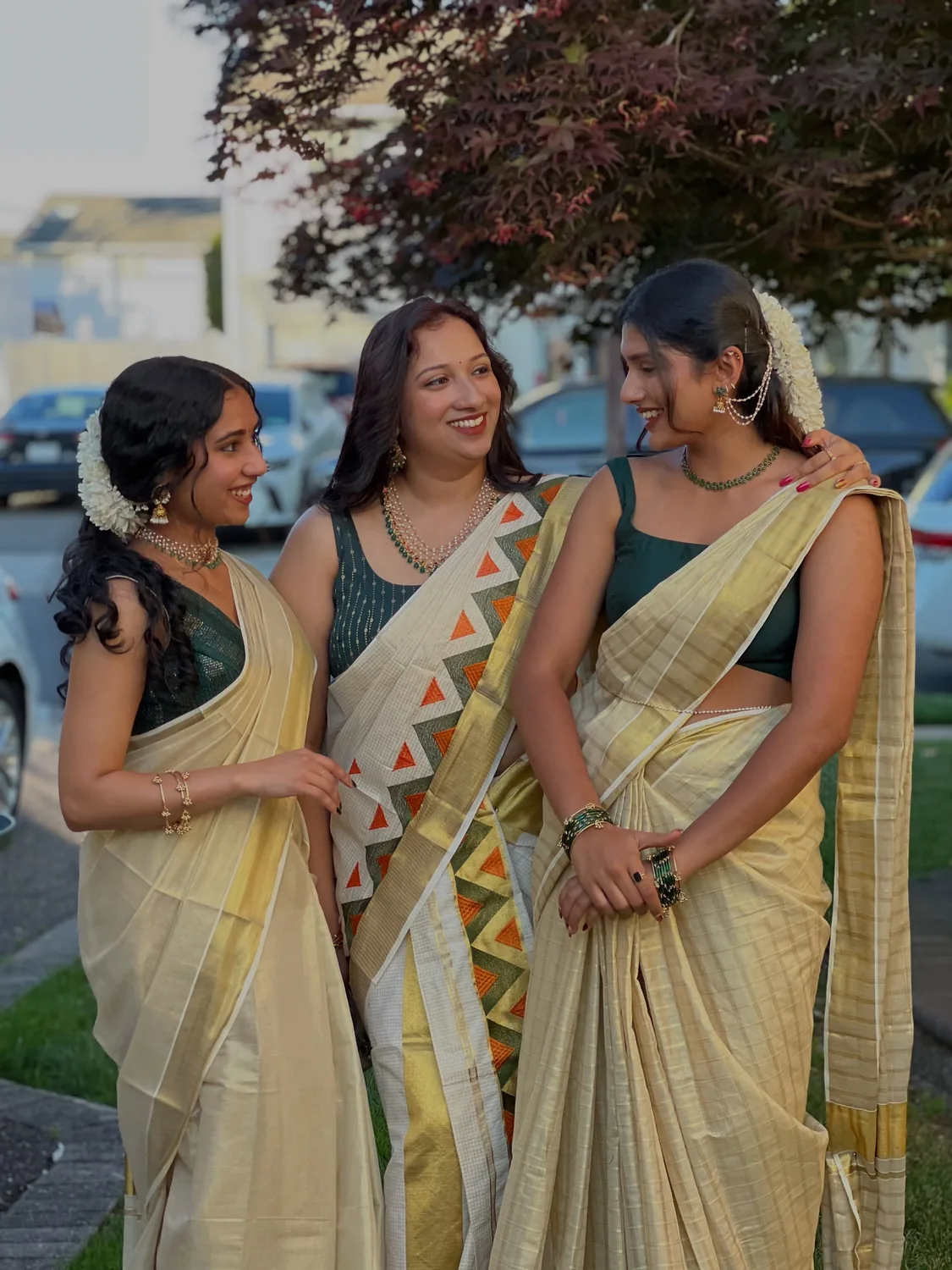 Three Alankara models in coordinated Onam jewellery looks