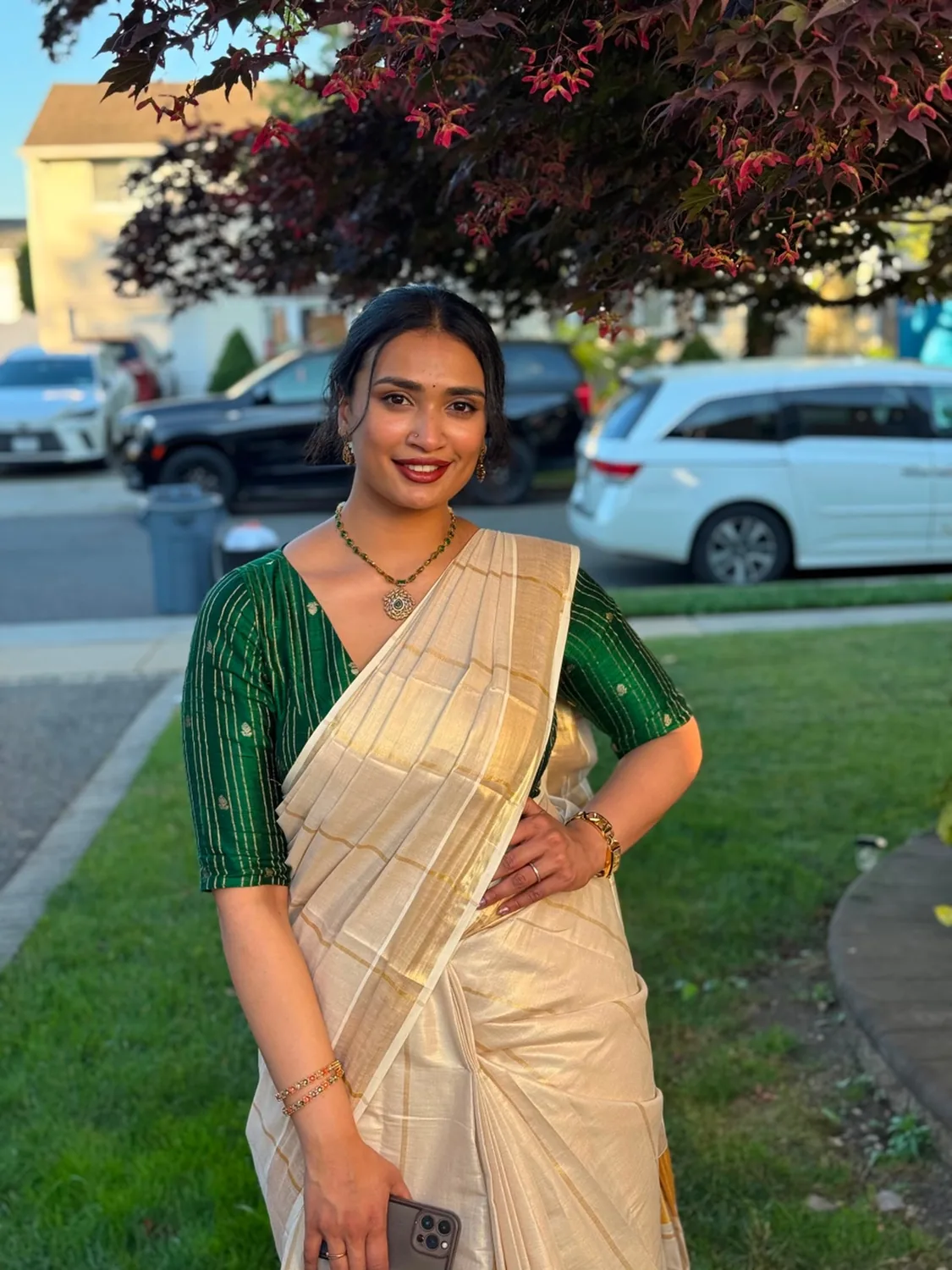 Alankara model wearing a green pendant necklace and slim bangles