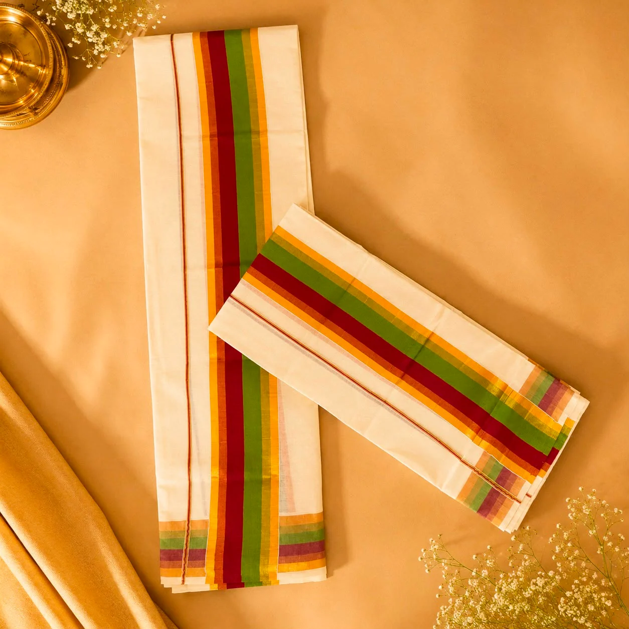 Ivory Kerala set mundu with red, green and gold woven borders
